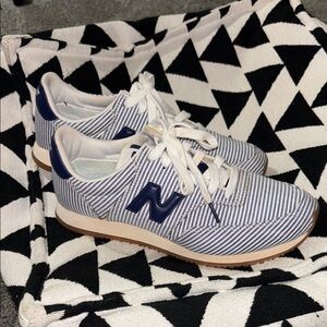 New Balance® X Comp 100 sneakers in blue white stripe size 8.5